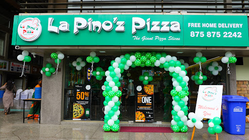 Image: La Pinoz Pizza logo featuring bold red and green typography.