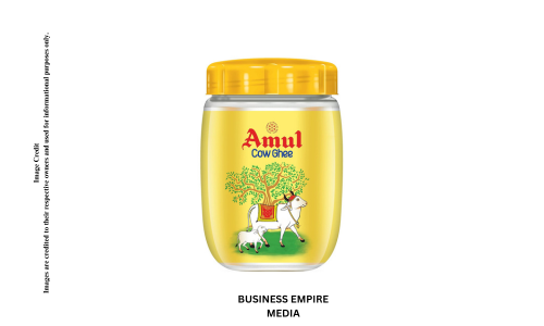 Amul Ghee in a transparent jar, showcasing its rich golden color and smooth texture. The label features the Amul logo with a traditional design, indicating its premium quality and authenticity